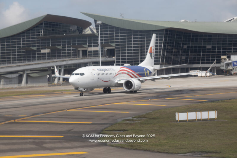 a white airplane on a runway