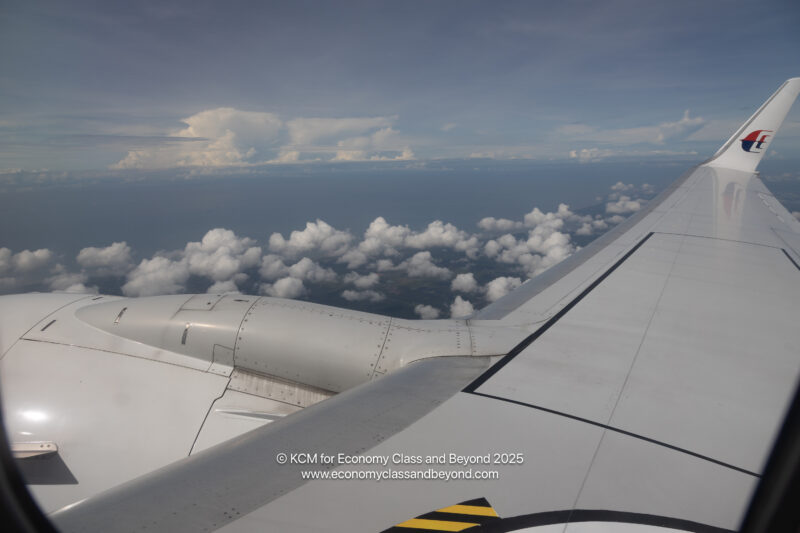 the wing of an airplane above clouds