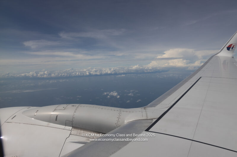 an airplane wing and sky