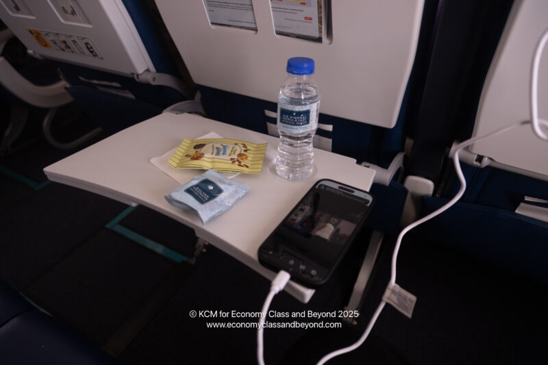 a phone and a bottle on a table