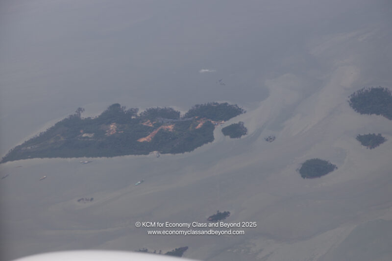 an aerial view of an island in the middle of a body of water