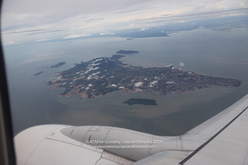 an airplane wing and an island