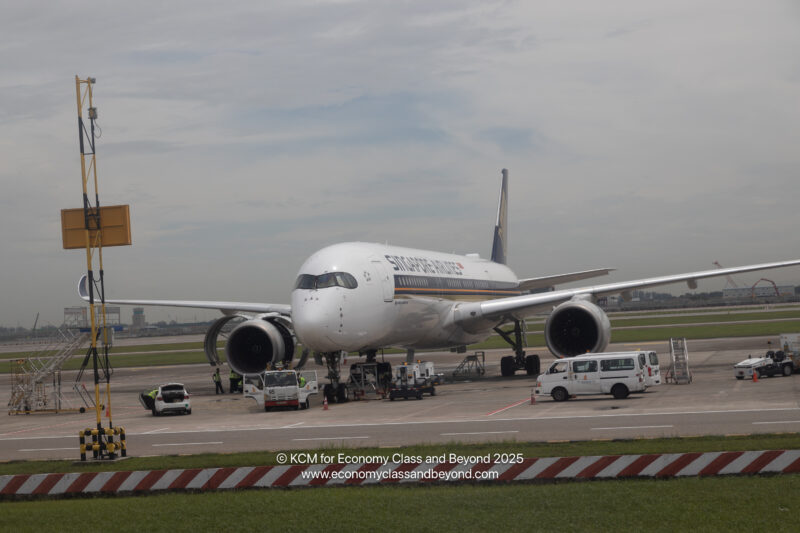 a white airplane on a runway