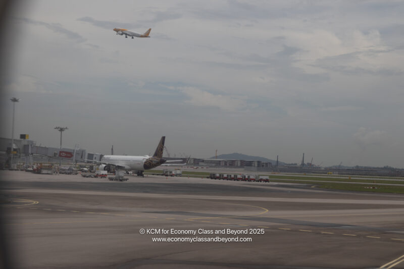 an airplane flying over an airport
