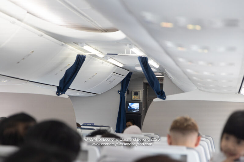 a group of people sitting in an airplane