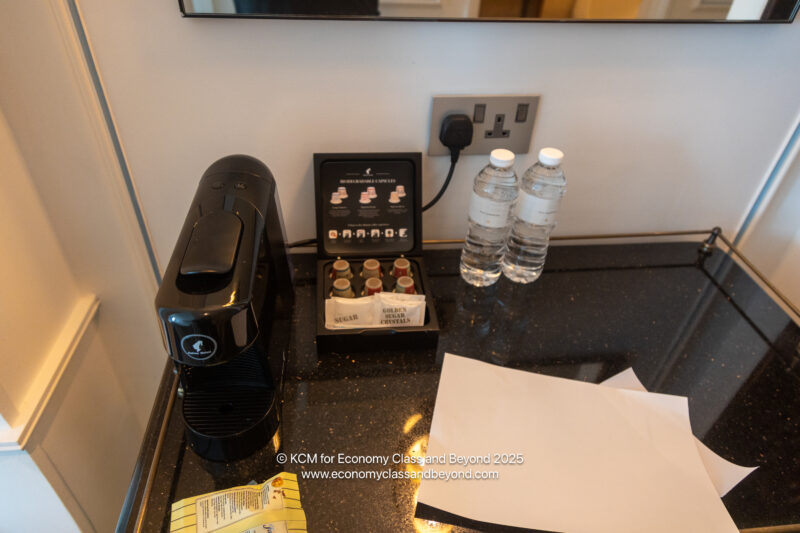 a coffee machine and a box of water