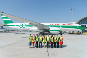a group of people standing in front of an airplane