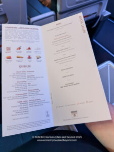 a hand holding a menu