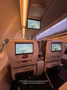 a seats with monitors on the side of the plane