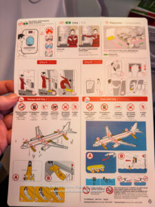 a hand holding a paper with instructions