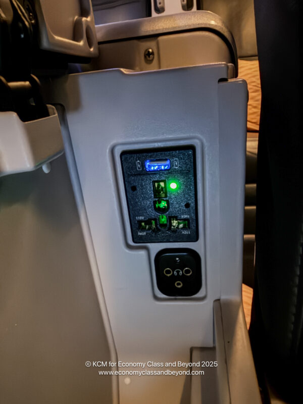 a power outlet with green lights