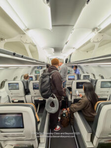 people in an airplane with many monitors