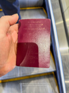 a hand holding a passport