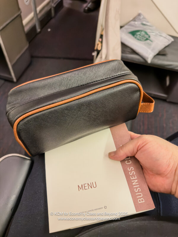 a hand holding a menu