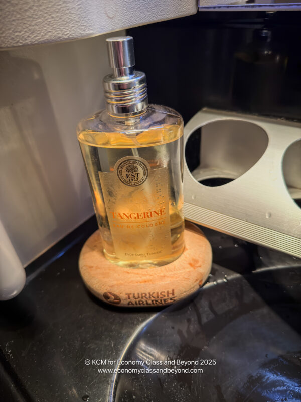 a bottle of liquid on a coaster