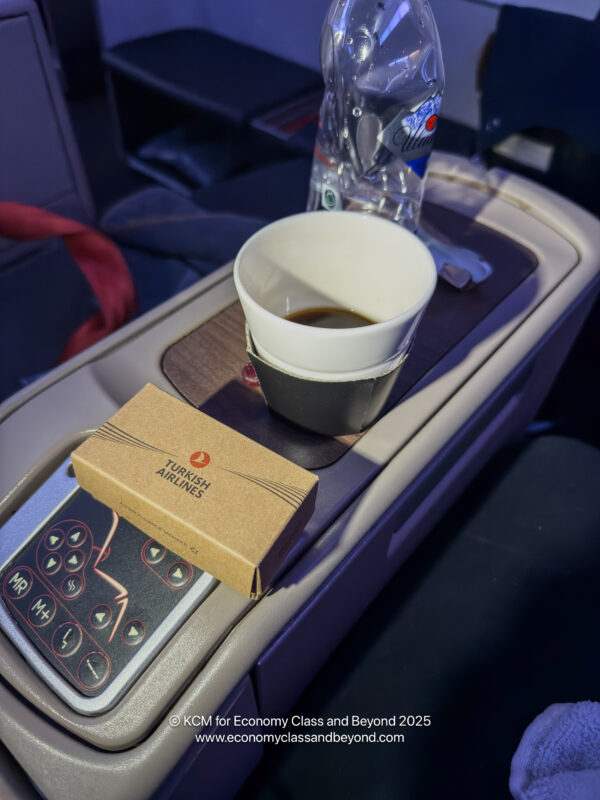 a cup of coffee and a box on a table