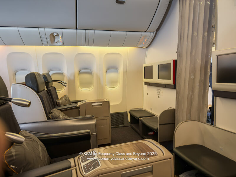 a interior of an airplane with seats and windows