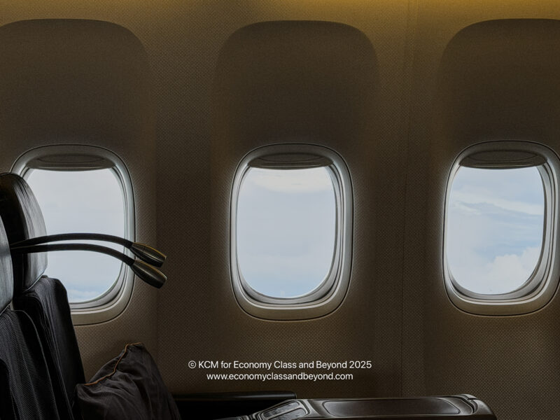 a seat in an airplane with windows