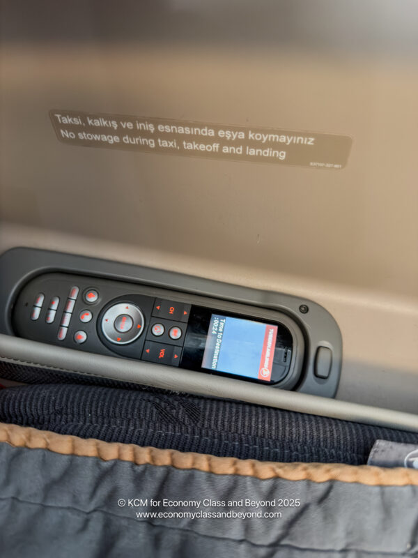 a remote control in a seat