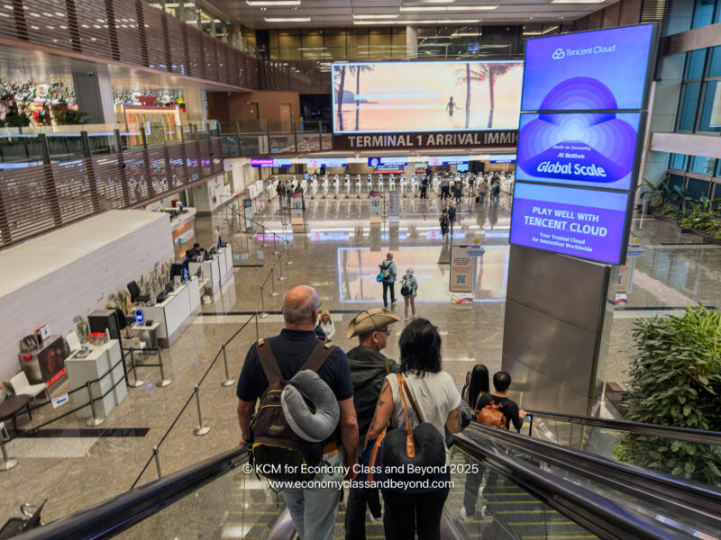 people on an escalator in a building