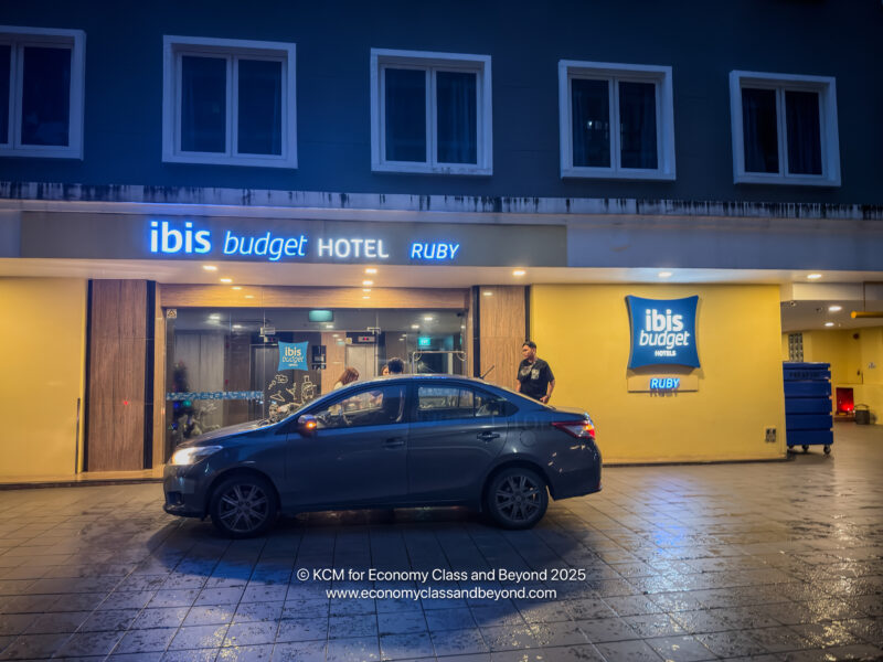 a car parked outside of a hotel