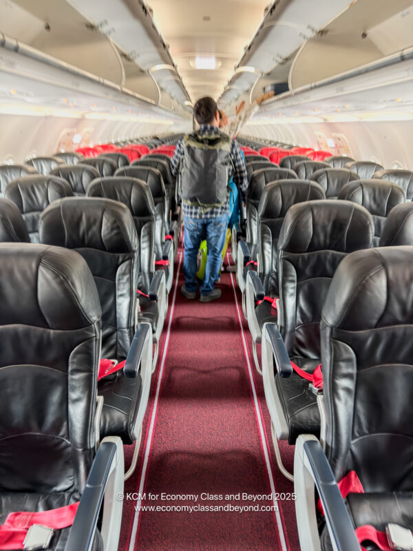 a man walking in an airplane