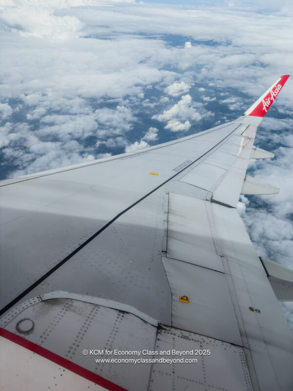 the wing of an airplane above the clouds