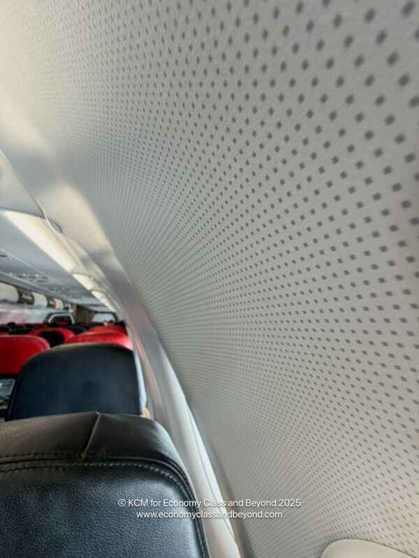 a plane with seats and a wall