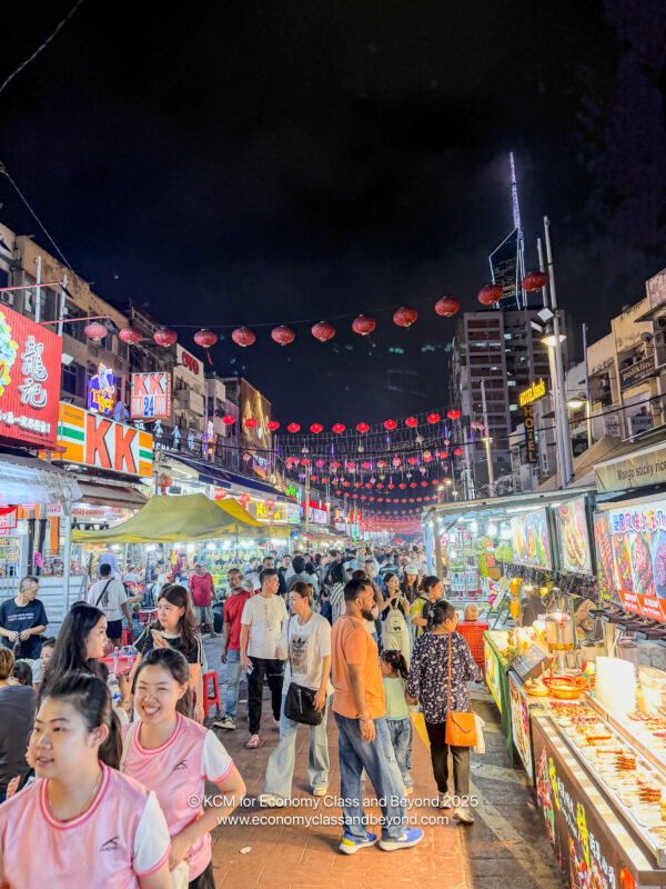 a crowd of people walking in a street