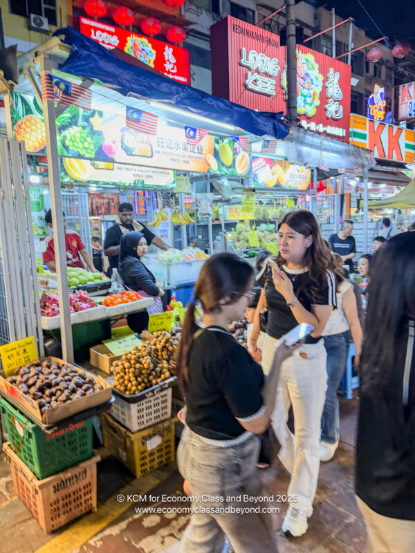 a group of people standing in a market