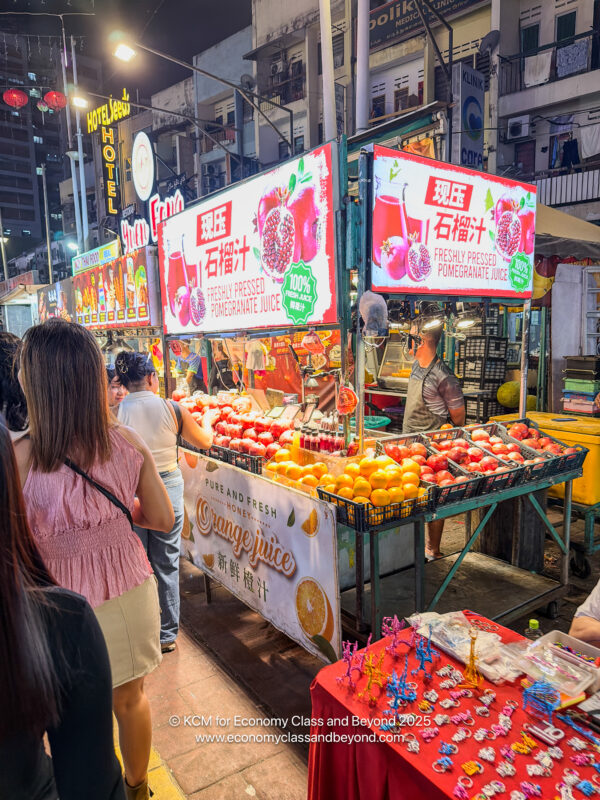 people at a fruit stand