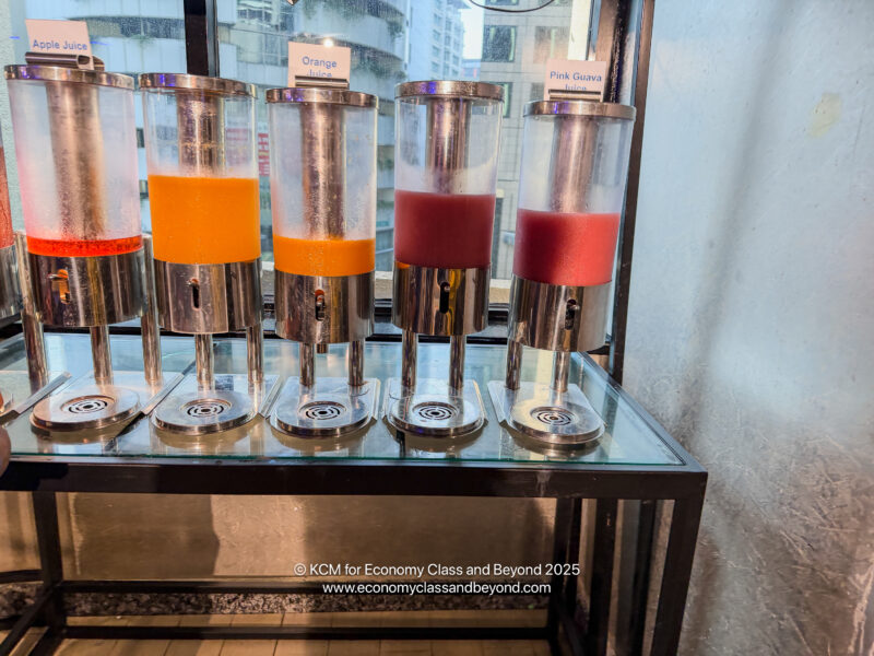 a group of liquid dispensers on a table