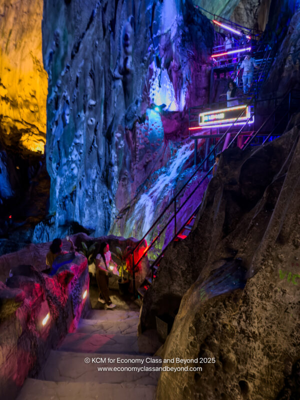 a group of people on stairs in a cave