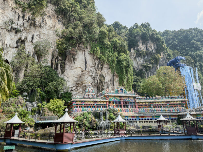 Batu Caves next to a body of water