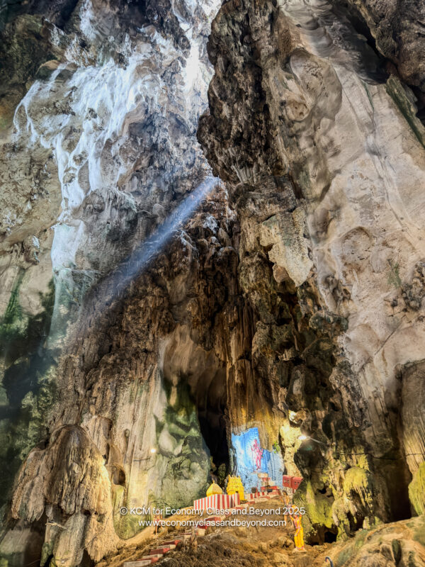 a cave with a light shining through