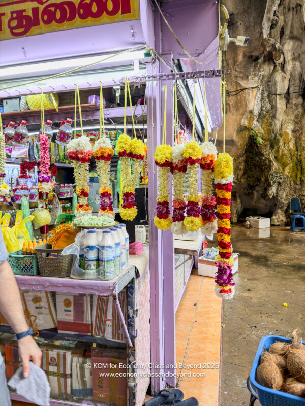 a store with colorful flowers from strings