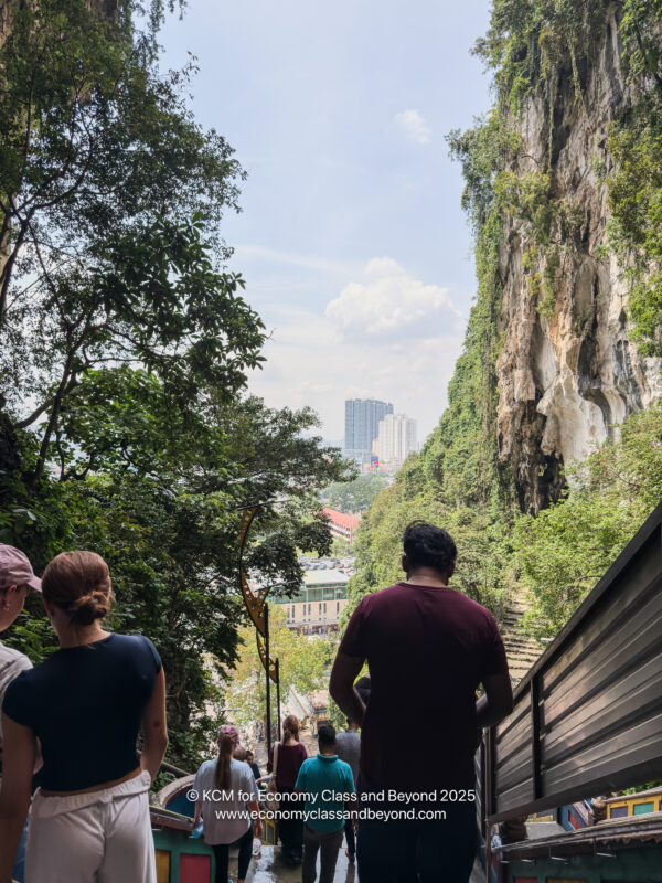 a group of people walking down a hill