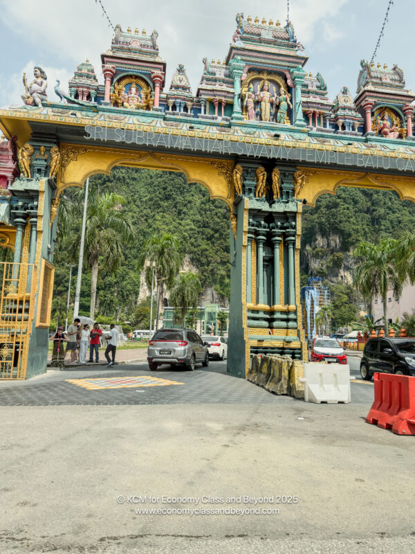 a large ornate archway with statues on top