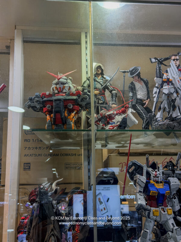a group of action figures in a glass case
