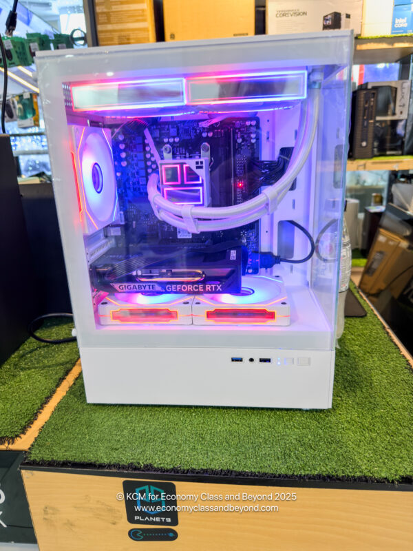 a white computer tower with a pink light inside