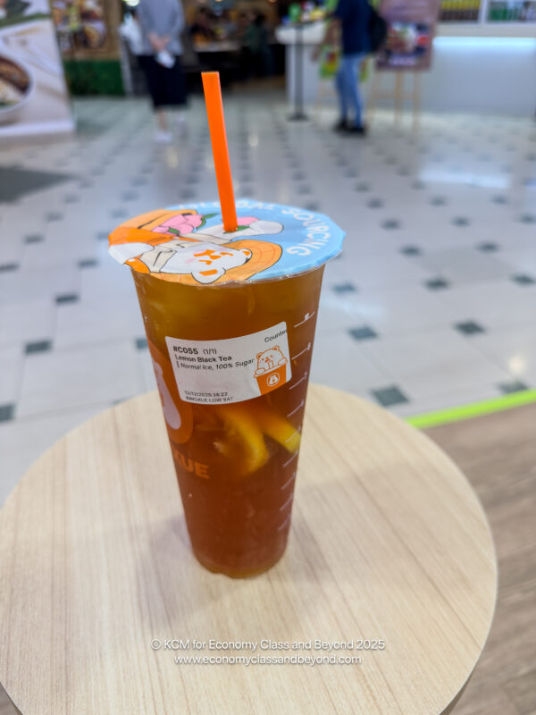 a cup of iced tea with a straw