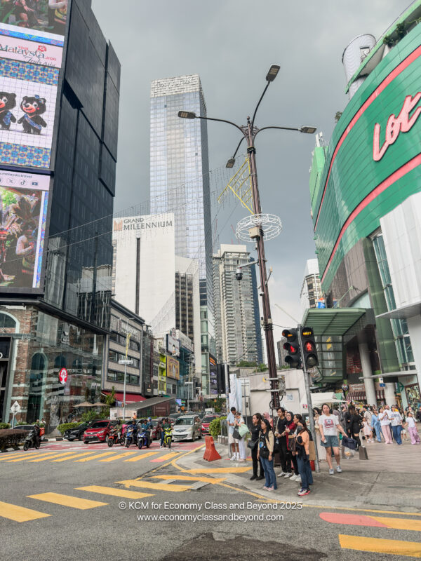 a group of people standing on a street corner