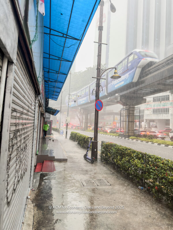 a train on a track in the rain