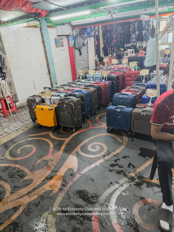 a room with many luggage bags