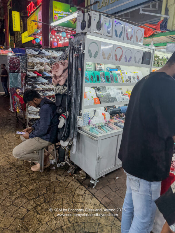 a man sitting on a bench in a store