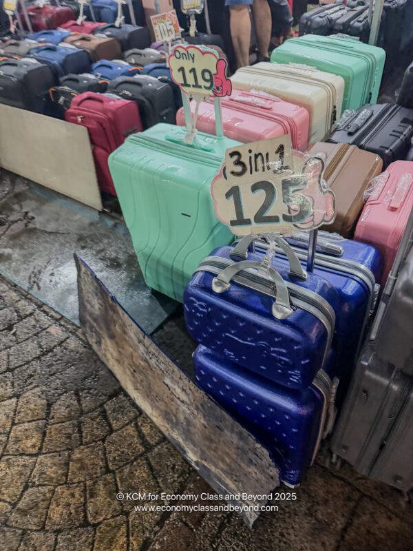a group of suitcases on a sidewalk