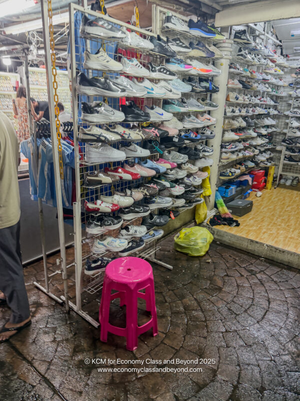 a store with many shoes on shelves