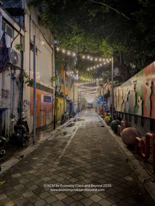 a street with lights and trees