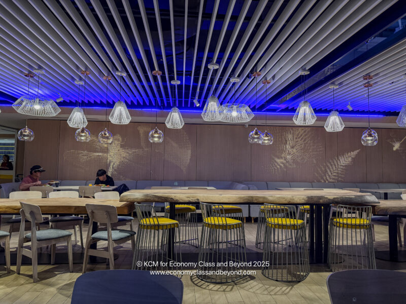 a room with a long table and chairs