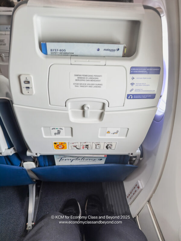 a seat with a shelf and a shoe on the side